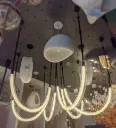 Sculptural arc linear chandelier light zone